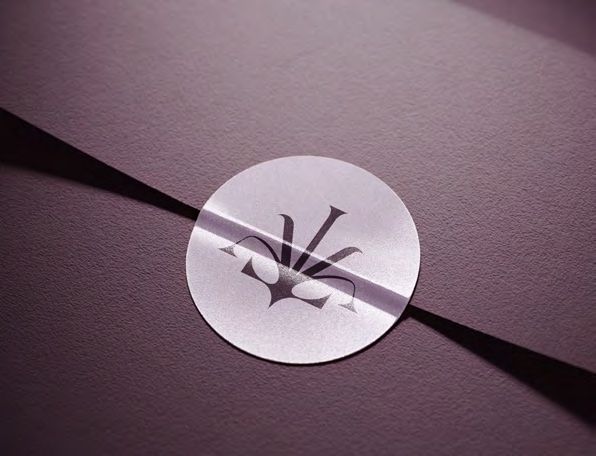 Embossed Lavielle monogram on a mauve card
